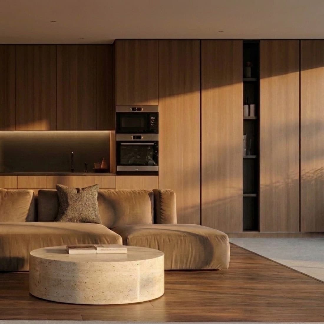A walnut living room with a travertine coffee table and a curved sofa